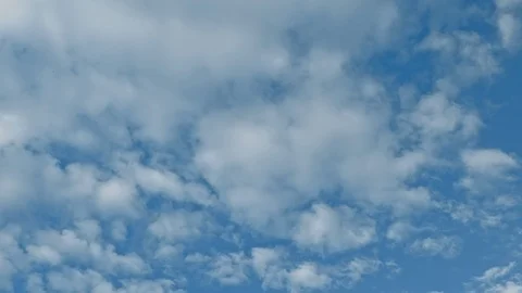 Time lapse of blue sky and white clouds moving around. Stock Footage 108542219