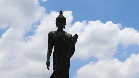 Time lapse, blue sky and white cloud, front of Buddha statue Stock Footage 139002702