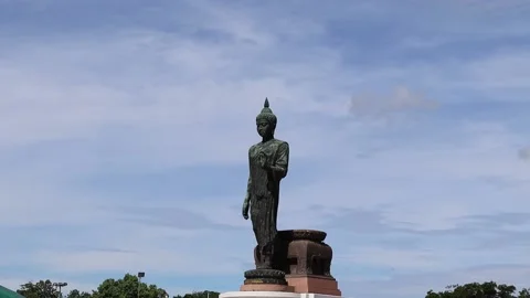 Time lapse, blue sky and white cloud, front of Buddha statue Stock Footage 140110308