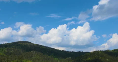 Time lapse of blue sky with clouds over mountain Stock-Footage 108861043
