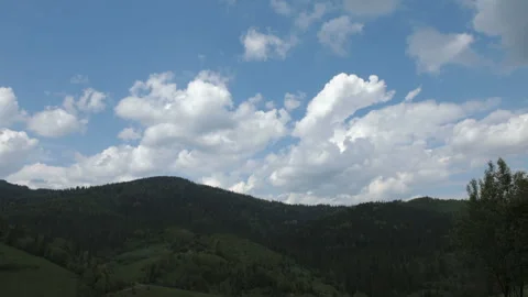 Time lapse of blue sky with clouds over mountain Stock Footage 108894168