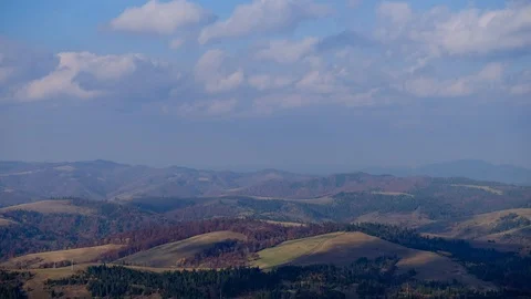 Time lapse of blue sky with clouds over mountain hills. Autumn sunny day land Stock Footage 120791170
