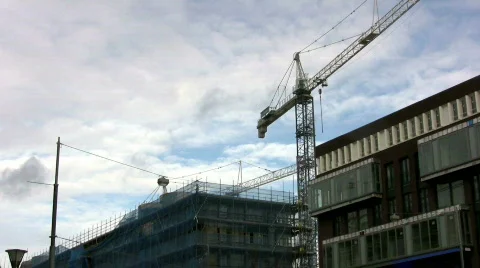 Time-lapse: Blue sky moving over building construction Stock Footage 108269
