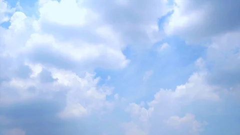 Time lapse of blue sky with white fluffy cloud Stock Footage 107677667
