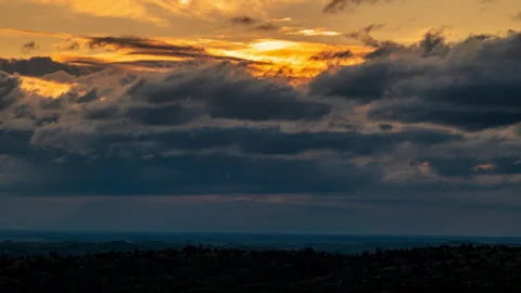 Time Lapse of Blue Storm Clouds Obscuring Yellow Sunset Stock Footage 278350843