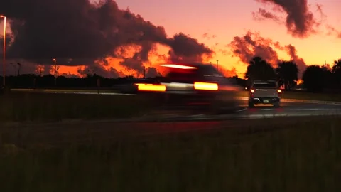 Time lapse blurred motion of many cars passing fast with red backlights on the Stock Footage 262162983