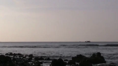 Time lapse of a boat moving across the horizon, at the sea - 042e Stock Footage 84045291
