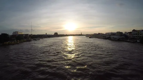 Time lapse of boat passing though the river, sunset background, riverside Stockbeeldmateriaal 92798119