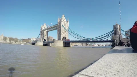Time-lapse of boat passing through Tower Bridge with tourists watching 스톡 동영상 64539540