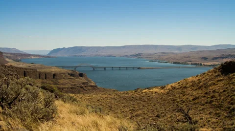 Time Lapse of boat riding in a windy river by the bridge Stock Footage 32185352