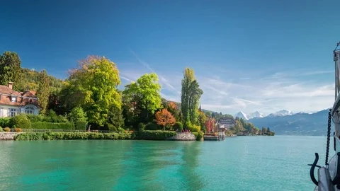 Time lapse of boat trip on lake with mountains on sunny day Stock Footage 81140125
