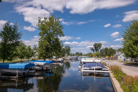 Time lapse of boats docked in small waterway Stock Footage 138119924