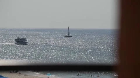 Time-lapse of Boats Passing By In The Ocean Stockbeeldmateriaal 64454425