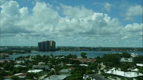 Time lapse of boats passing through Bay clouds moving Palm Beach shores Florida Stock Footage 213137847