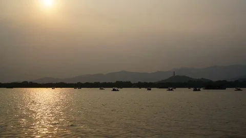 Time Lapse of Boats on River at Sunset Stock Footage 77695457
