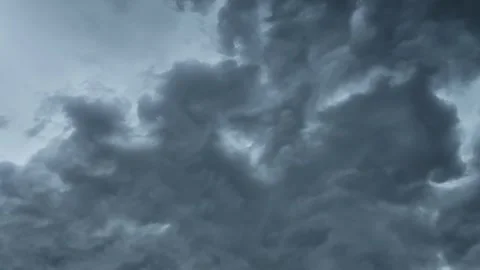 Time lapse of boiling blue-gray storm clouds churning in the summer sky. The Stock Footage 335898178