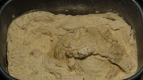Time lapse of bread machine kneading ingredients Stock Footage 99956125