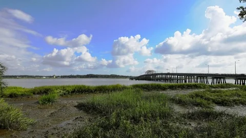 Time lapse of bridge, river, and clouds Stock-Footage 71144749