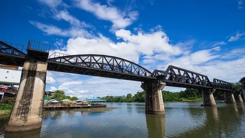 Time-lapse of the Bridge River Kwai with train in Kanchanaburi, Thailand Stock Footage 77287501