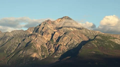 A time lapse of a bright lit large mountain Stock Footage 139349407