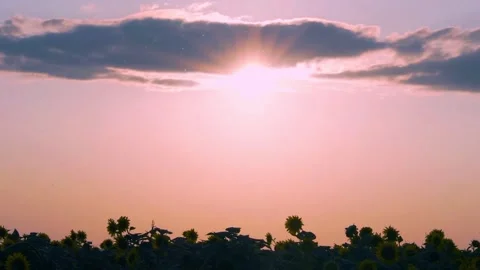 Time Lapse of the Bright Orange Blue Sky Sun Colored Cloud at Sunset in a Field  Stock-Footage 324890135