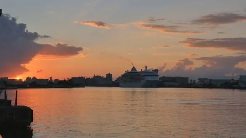 Time Lapse Bright orange sun rises over San Juan Puerto Rico harbor Stock Footage 73283311
