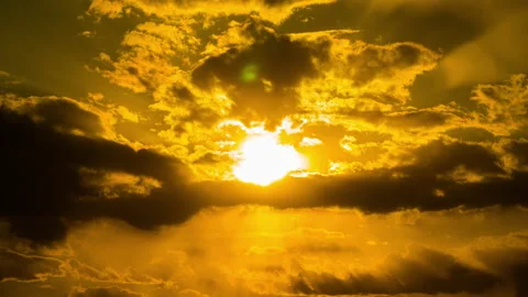 Time Lapse Bright Orange Sunset Sun Sets Behind the Clouds Video stock 194567478