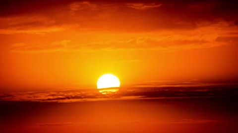 Time Lapse Bright Orange Sunset Sun Sets Behind the Clouds Stock Footage 209413213