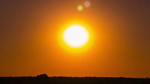 Time Lapse Bright Orange Sunset Sun Sets Behind the Clouds Stock Footage 209422040
