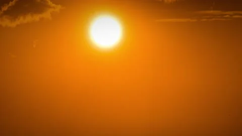 Time Lapse Bright Orange Sunset Sun Sets Behind the Clouds Video stock 209911527