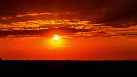 Time Lapse Bright Orange Sunset Sun Sets Behind the Clouds Stock Footage 209915881