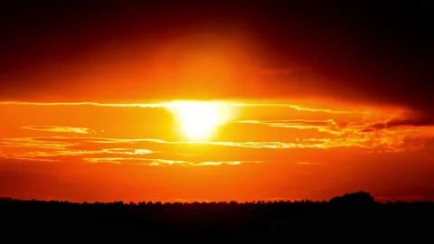 Time Lapse Bright Orange Sunset Sun Sets Behind the Clouds 스톡 동영상 214548703