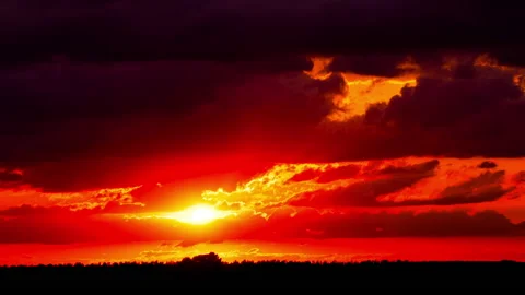 Time Lapse Bright Orange Sunset Sun Sets Behind the Clouds 스톡 동영상 214549727