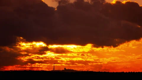 Time Lapse Bright Orange Sunset Sun Sets Behind the Clouds Stock Footage 218015520