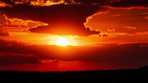 Time Lapse Bright Orange Sunset Sun Sets Behind the Clouds Stock Footage 218016583