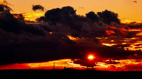 Time Lapse Bright Orange Sunset Sun Sets Behind the Clouds 스톡 동영상 218157278