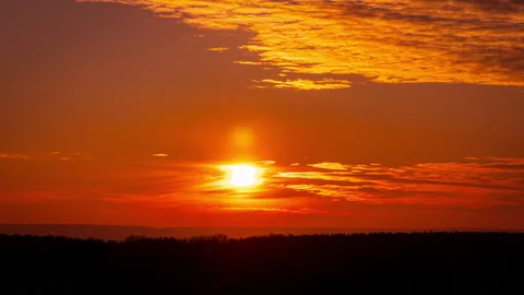 Time Lapse Bright Orange Sunset Sun Sets Behind the Clouds Stock Footage 229493351