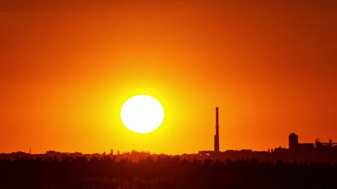 Time Lapse Bright Orange Sunset Sun Sets Behind the Clouds Stock Footage 229545343
