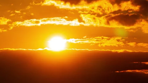 Time Lapse Bright Orange Sunset Sun Sets Behind the Clouds Stock Footage 229545683