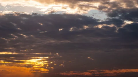 Time Lapse Bright Orange Sunset Sun Sets Behind the Clouds Stock Footage 229638390