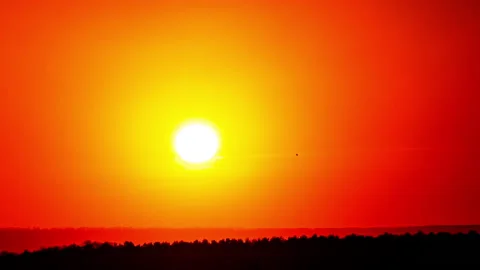 Time Lapse Bright Orange Sunset Sun Sets Behind the Clouds Stock Footage 232102843