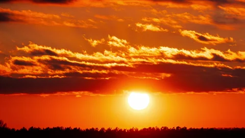 Time Lapse Bright Orange Sunset Sun Sets Behind the Clouds Video stock 237329803
