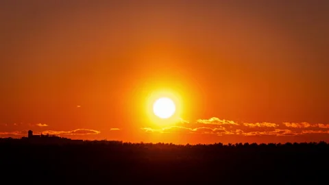 Time Lapse Bright Orange Sunset Sun Sets Behind the Clouds Stock Footage 237349579