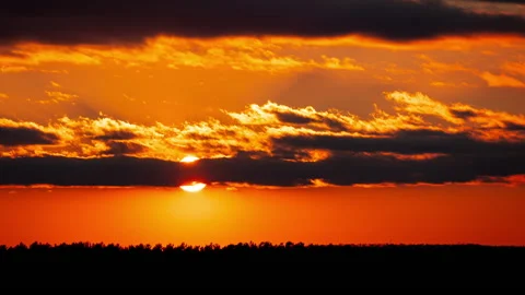 Time Lapse Bright Orange Sunset Sun Sets Behind the Clouds Stock Footage 237509410