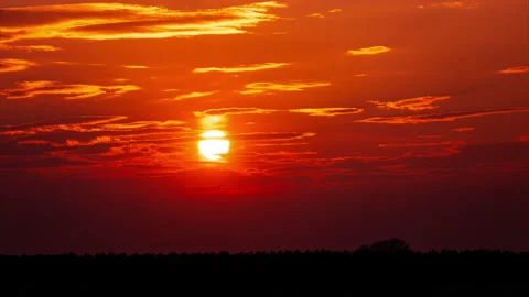 Time Lapse Bright Orange Sunset Sun Sets Behind the Clouds Stock Footage 237802754