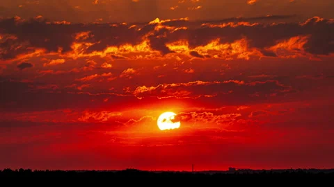Time Lapse Bright Orange Sunset Sun Sets Behind the Clouds Stock Footage 252177542