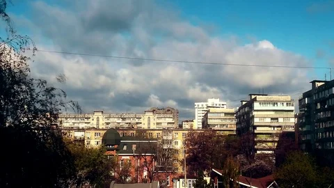 Time lapse with bubbling and boiling clouds moving over city with high rise Stock Footage 75923374