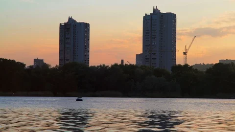 Time-Lapse, Building Crane Turns the Arrow on the Background of the Sunset Sky Stock Footage 90455295
