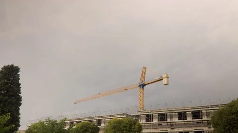 Time lapse of a building site with yellow tower crane moving  Stock Footage 141918178