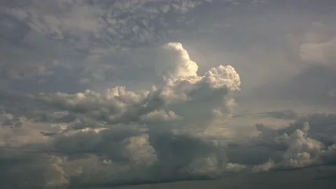 Time lapse of a building storm cloud with a pink hue in a moody sky Stock Footage 205466268